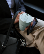 hand-holding-cup-and-phone